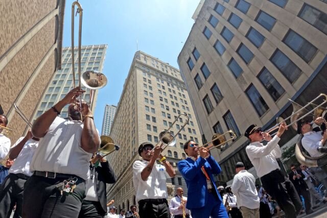 Jazz parade makes its way through downtown New Orleans. 