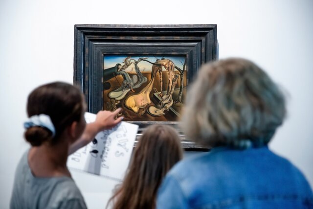 Visitors looking at artwork at the Salvador Dalí Museum in St. Petersburg, Florida