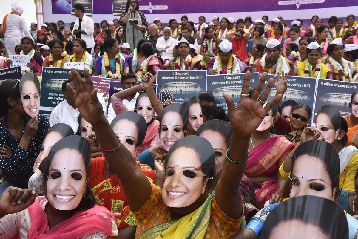 Supporters wearing face masks of Bharat Rashtra Samithi (BRS) leader K. Kavitha, during a hunger strike for Women’s Reservation Bill, at Jantar Mantar in New Delhi on March 10. 