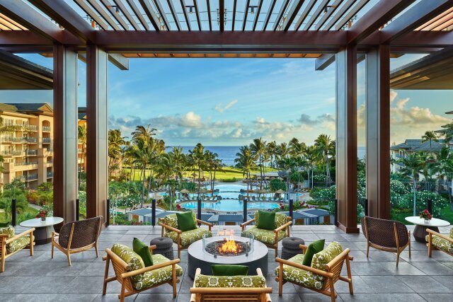 An outdoor courtyard with a fire pit and views of the grounds at The Ritz-Carlton Maui, Kapalua