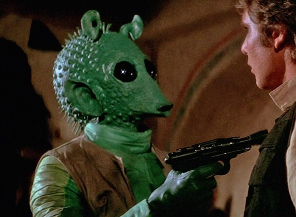 Paul Blake's Greedo with Harrison Ford's Han Solo in a still from Star Wars